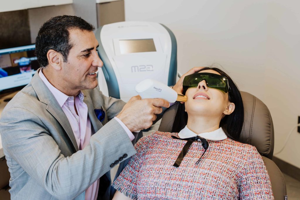 Dr. Kevin Sadati with Patient at Gallery of Cosmetic Surgery performing Laser Skin Resurfacing in Newport Beach, CA